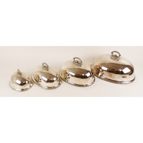 110A - A set of four graduated silver plated dish covers, each of oval form with beaded borders and cast ha... 