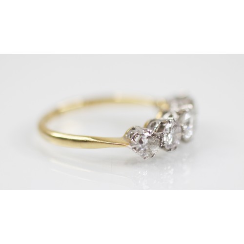 188 - An early 20th century five stone diamond ring, the central round brilliant cut diamond measuring 4.7... 