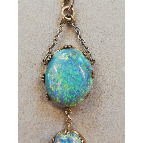 224 - An early 20th century black opal pendant, designed as an oval opal cabochon measuring 17.0mm x 14.0m... 