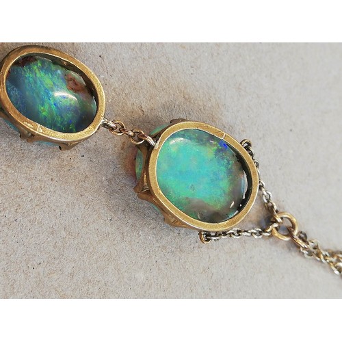 224 - An early 20th century black opal pendant, designed as an oval opal cabochon measuring 17.0mm x 14.0m... 