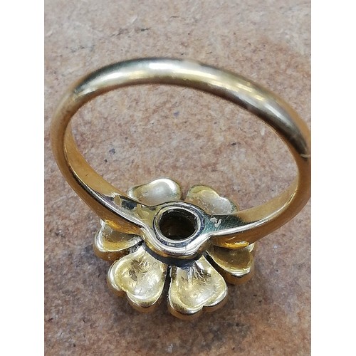 150 - A Victorian pearl and diamond floral ring, comprising a central old cut diamond weighing approximate... 