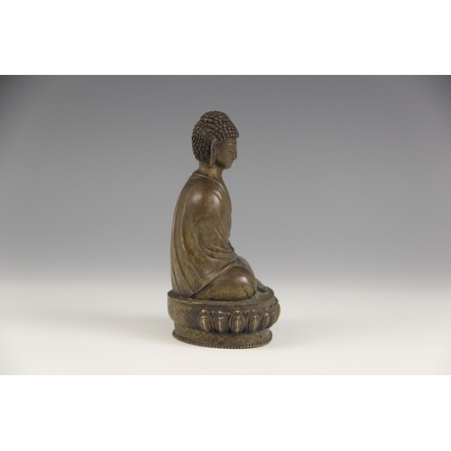 415 - A bronze model of Buddha, possibly Sino-Tibetan, 18th/19th century, modelled seated in dhyanasana on... 