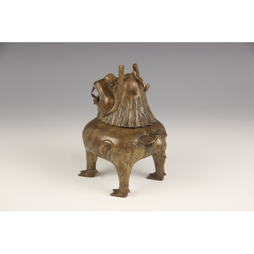 404 - A Chinese bronze 'Luduan' incense burner, modelled standing on four legs with hinged head forming th... 