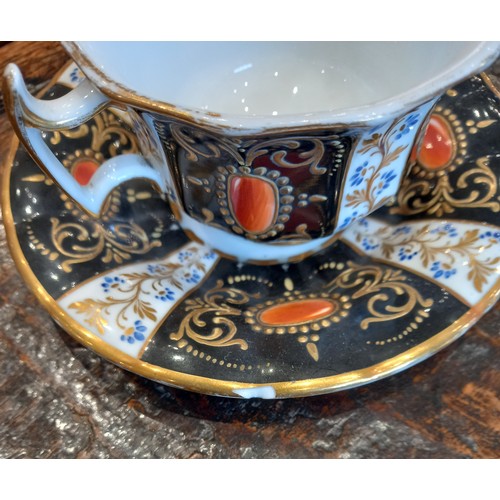 448 - A selection of porcelain teacups and saucers, 19th century, each of faceted London shape with flared... 