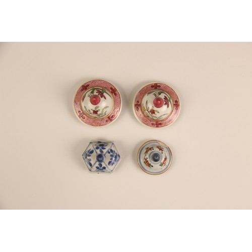 394 - A pair of Chinese porcelain vases and covers, 20th century, in the famille rose palette and of balus... 