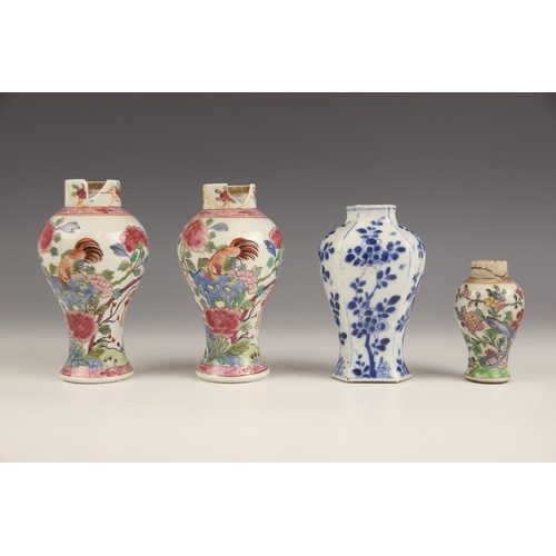 394 - A pair of Chinese porcelain vases and covers, 20th century, in the famille rose palette and of balus... 