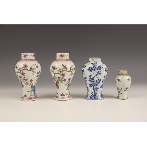 394 - A pair of Chinese porcelain vases and covers, 20th century, in the famille rose palette and of balus... 