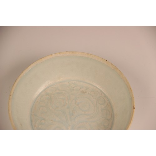 380 - A Chinese Qingbai 'flower' dish, Song Dynasty, the circular dish with incised floral motifs enclosed... 