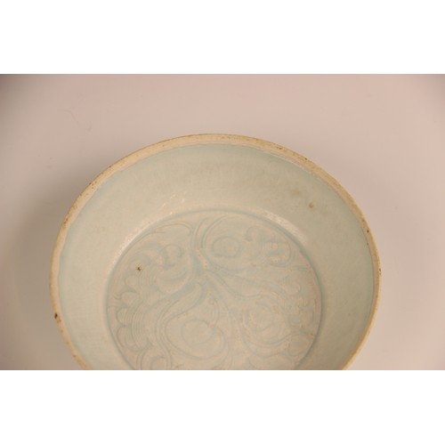 380 - A Chinese Qingbai 'flower' dish, Song Dynasty, the circular dish with incised floral motifs enclosed... 