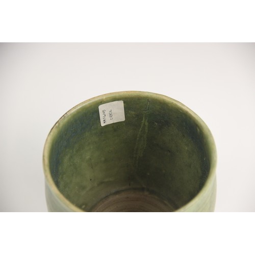 378 - An Anamese pottery vessel, possibly 15th century, the cylindrical vase celadon glazed to the interio... 