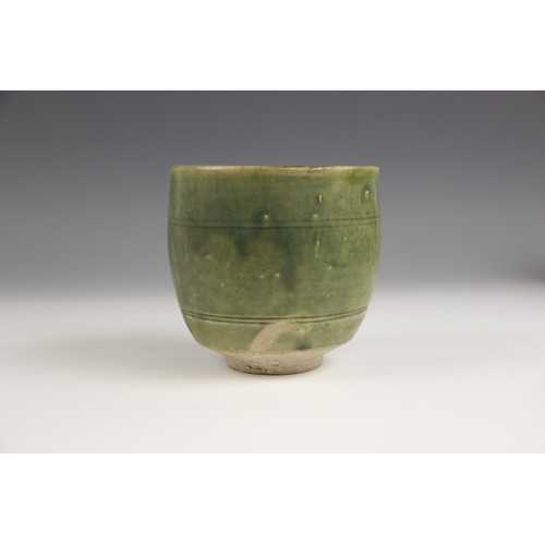 378 - An Anamese pottery vessel, possibly 15th century, the cylindrical vase celadon glazed to the interio... 