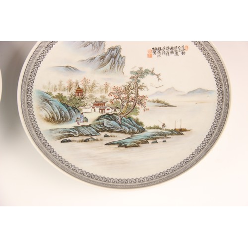 392 - A pair of Chinese porcelain plates, Republic period style, each of circular form and decorated in a ... 