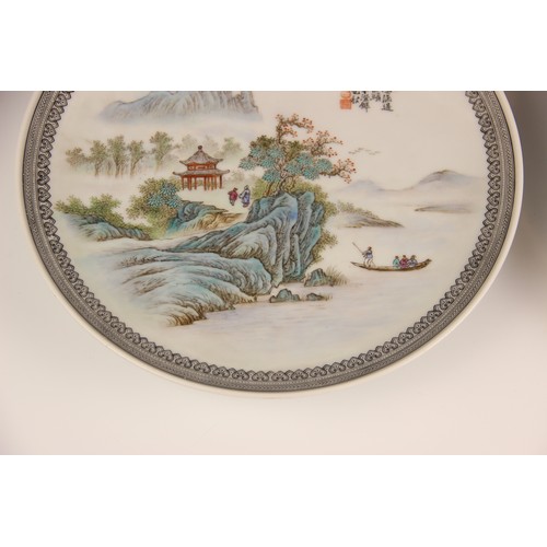 392 - A pair of Chinese porcelain plates, Republic period style, each of circular form and decorated in a ... 