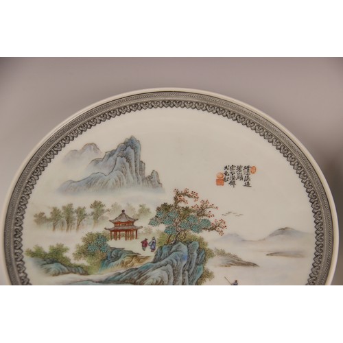 392 - A pair of Chinese porcelain plates, Republic period style, each of circular form and decorated in a ... 