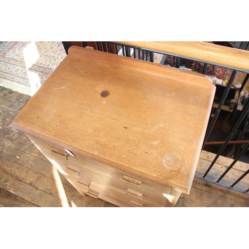 710 - A honey oak chest of drawers by Waring & Gillow, early 20th century, the rectangular moulded top wit... 