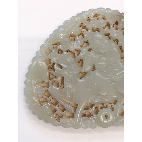 412 - A Chinese jade carving, carved with a reticulated design depicting a Chinese deity, possibly Shou La... 