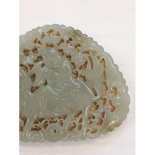 412 - A Chinese jade carving, carved with a reticulated design depicting a Chinese deity, possibly Shou La... 