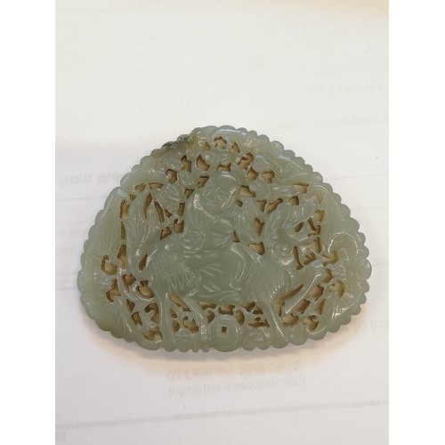 412 - A Chinese jade carving, carved with a reticulated design depicting a Chinese deity, possibly Shou La... 