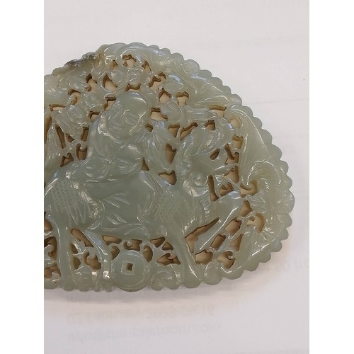 412 - A Chinese jade carving, carved with a reticulated design depicting a Chinese deity, possibly Shou La... 