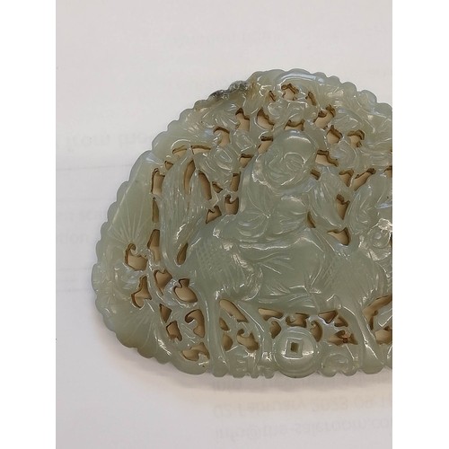 412 - A Chinese jade carving, carved with a reticulated design depicting a Chinese deity, possibly Shou La... 