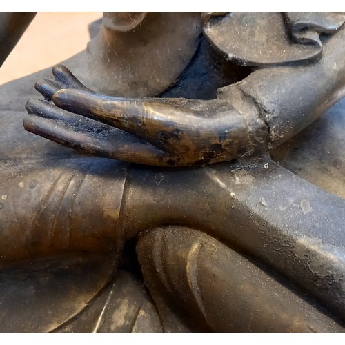 402 - A large Burmese bronze buddha, seated in  dhyanasana with hands placed in bhumisparsha mudra, sat up... 