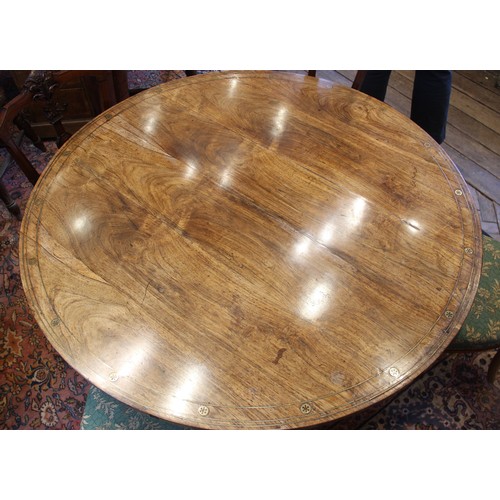 641 - A Regency rosewood and brass inlaid breakfast table, in the manner of George Oakley, early 19th cent... 