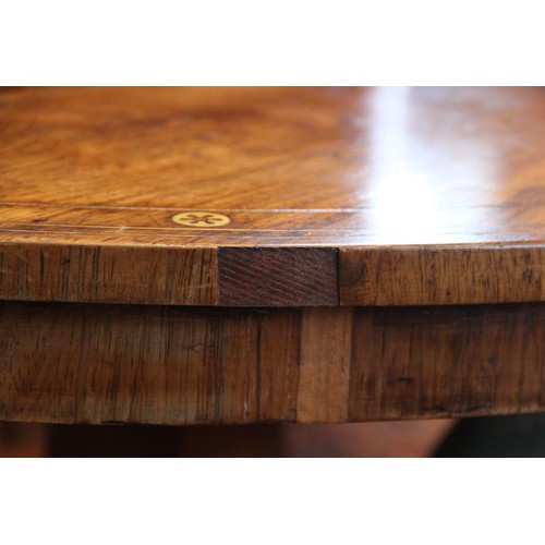 641 - A Regency rosewood and brass inlaid breakfast table, in the manner of George Oakley, early 19th cent... 