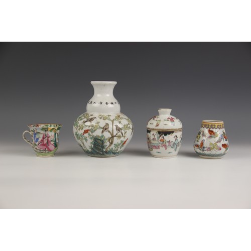 377 - A Chinese porcelain famille rose double-gourd vase, Qianlong six character mark, decorated with bird... 