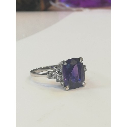 207 - A colour-change sapphire and diamond ring, the rectangular cushion mixed cut sapphire weighing 4.20 ... 