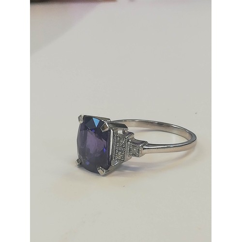 207 - A colour-change sapphire and diamond ring, the rectangular cushion mixed cut sapphire weighing 4.20 ... 