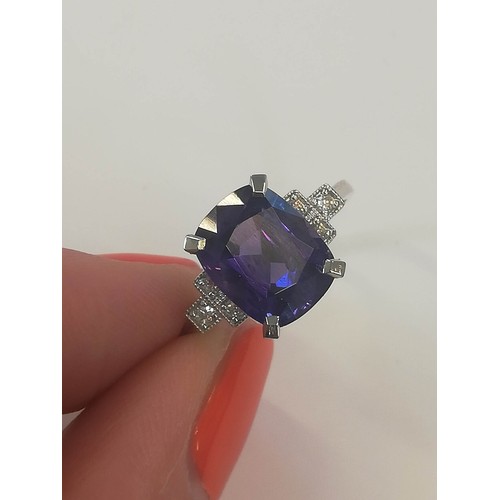 207 - A colour-change sapphire and diamond ring, the rectangular cushion mixed cut sapphire weighing 4.20 ... 