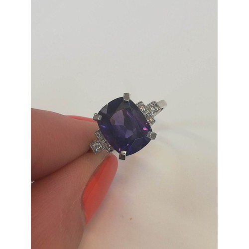 207 - A colour-change sapphire and diamond ring, the rectangular cushion mixed cut sapphire weighing 4.20 ... 