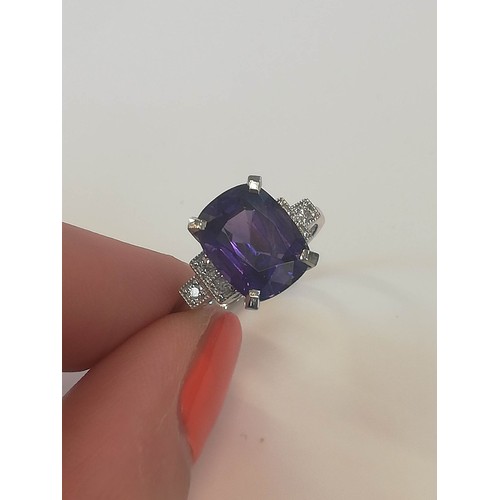 207 - A colour-change sapphire and diamond ring, the rectangular cushion mixed cut sapphire weighing 4.20 ... 