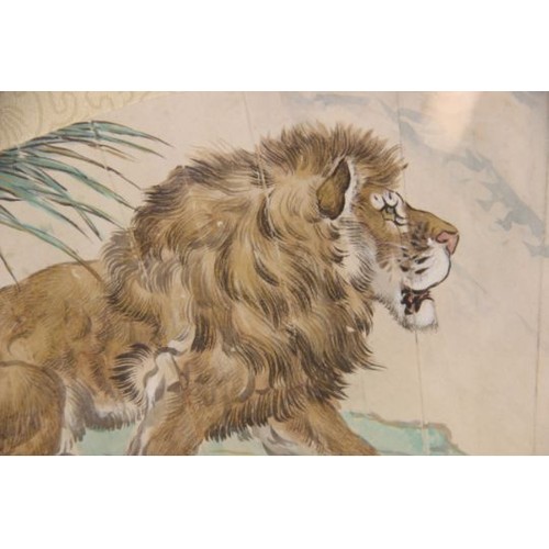 399 - Chinese School (20th century), watercolour laid on silk fan painting, depicting a lion on a rocky ou... 