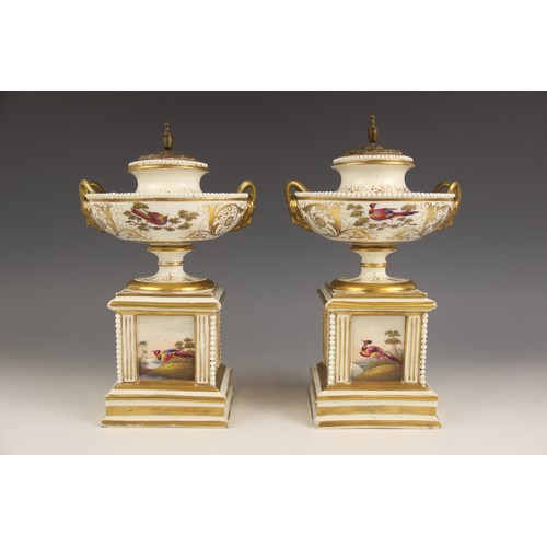 447 - A pair of Paris porcelain pot pouri, 19th century, each modelled as a hemispherical urn on square pl... 