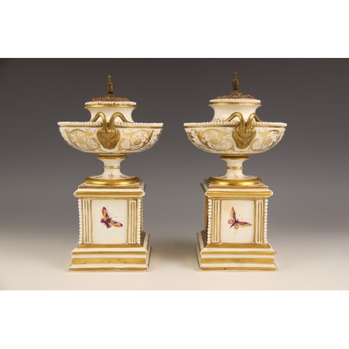 447 - A pair of Paris porcelain pot pouri, 19th century, each modelled as a hemispherical urn on square pl... 