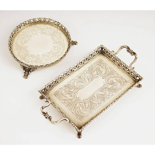 1 - A Portuguese miniature silver twin-handled tray, of rectangular form with pierced border and scrolli... 