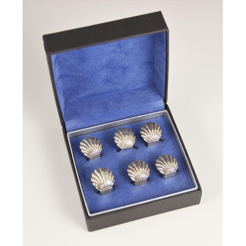 100 - A set of six silver menu or place name holders, Chamberlain Clarke Partnership, London 1997, each mo... 