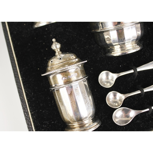 117 - A George V silver condiment set, Adie Brothers, Birmingham 1932, comprising two open salts, two pepp... 