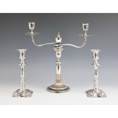 125 - A pair of silver plated candlesticks by Elkington and Co, each of baluster form and upon shaped squa... 