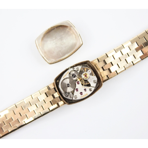 130 - A ladies 9ct gold Tudor wristwatch, the tonneau shaped dial with baton markers and Tudor emblem to t... 