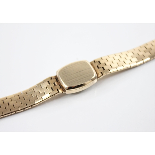 130 - A ladies 9ct gold Tudor wristwatch, the tonneau shaped dial with baton markers and Tudor emblem to t... 