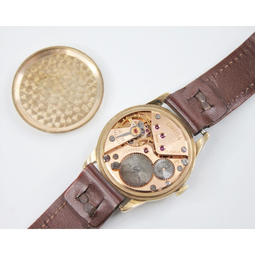 134 - A gentleman's vintage 9ct gold Omega Geneve wristwatch, the two-toned circular dial with arrowhead m... 