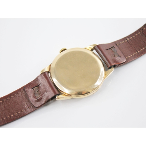 134 - A gentleman's vintage 9ct gold Omega Geneve wristwatch, the two-toned circular dial with arrowhead m... 