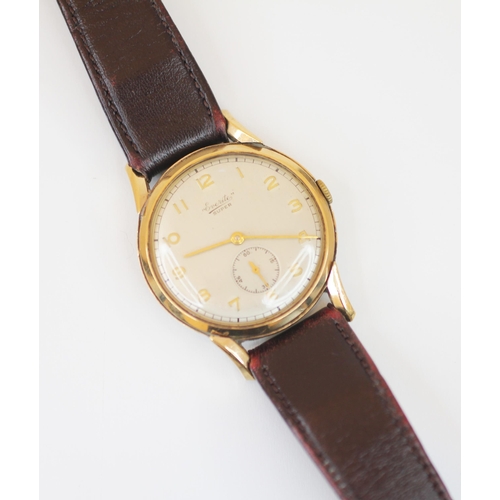 141 - A vintage gentleman's Everite 9ct gold wristwatch, the circular cream dial with gold coloured Arabic... 