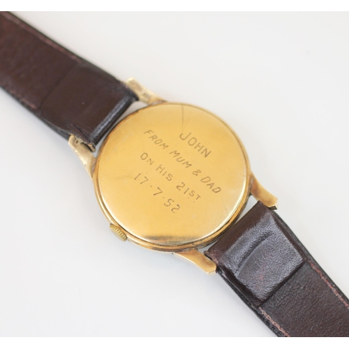 141 - A vintage gentleman's Everite 9ct gold wristwatch, the circular cream dial with gold coloured Arabic... 