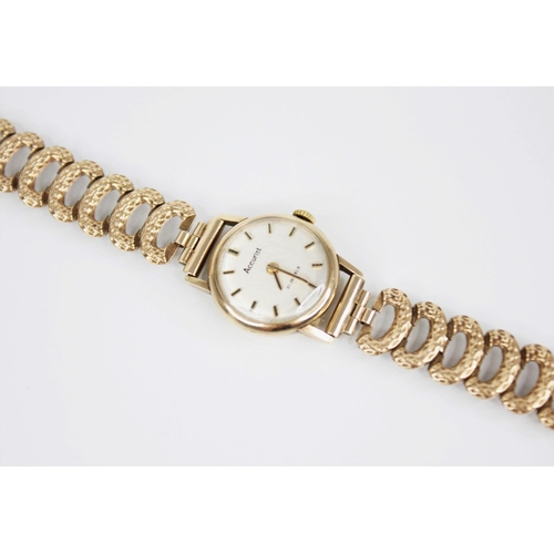 143 - A ladies Accurist 9ct gold wristwatch, the circular  dial with baton markers, set to a plain polishe... 