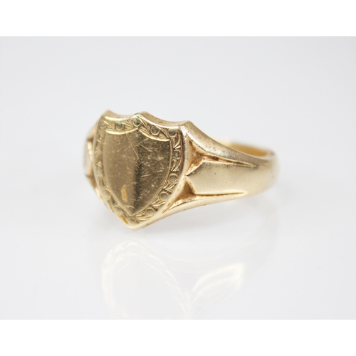 162 - A 9ct gold signet ring, of shield form with tapering shoulders and plain polished band, marks for 'G... 