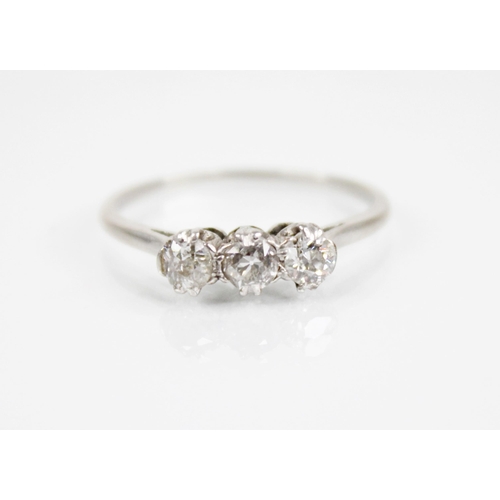 168 - An Art Deco three stone diamond ring, the central old cut diamond measuring approximately 4.2mm x 3.... 