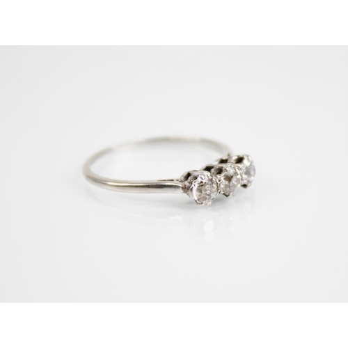 168 - An Art Deco three stone diamond ring, the central old cut diamond measuring approximately 4.2mm x 3.... 